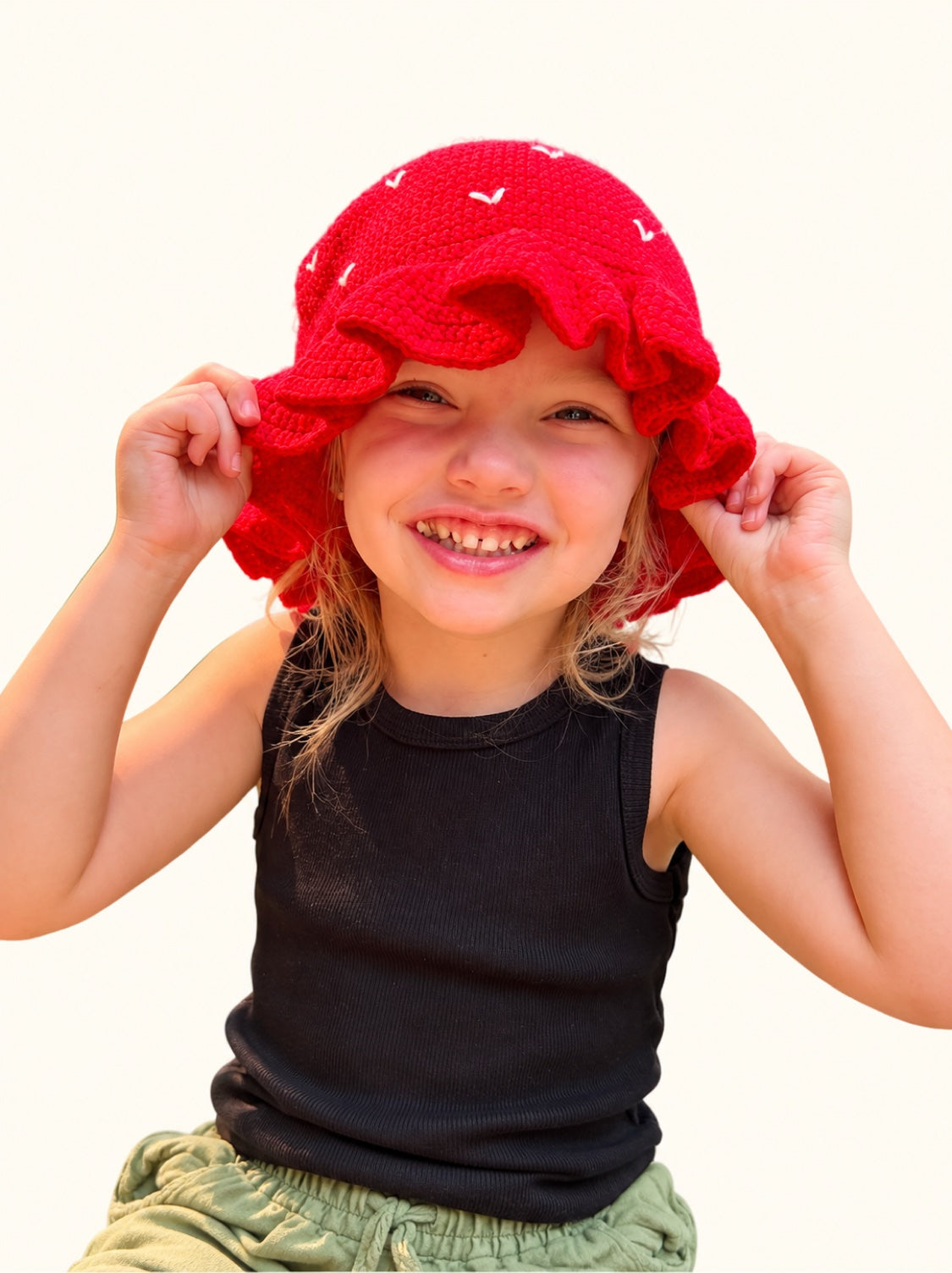 Preorder Strawberry hat worn by a young customer