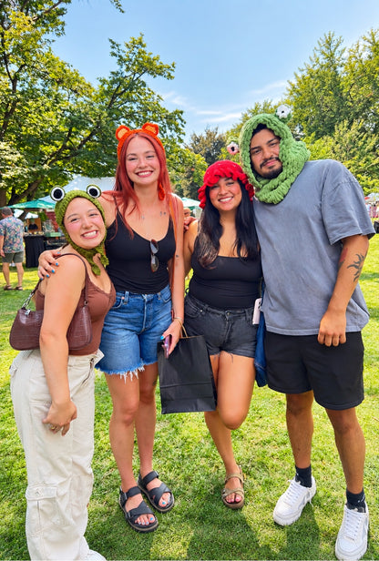 Frog Headband worn by a customer (left) with friends