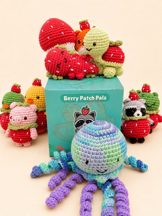 The Berry Patch Pals Series 1 crochet minis gathered around a blind box