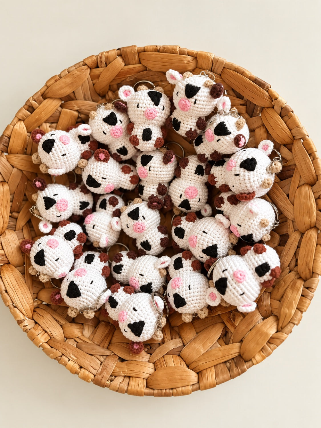 Cow crochet minis with keyrings in a basket