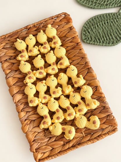 Yellow giraffe crochet minis in a basket