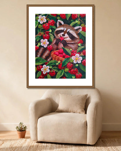 Raccoon & Raspberries framed print styled in a cozy reading corner — frame not included