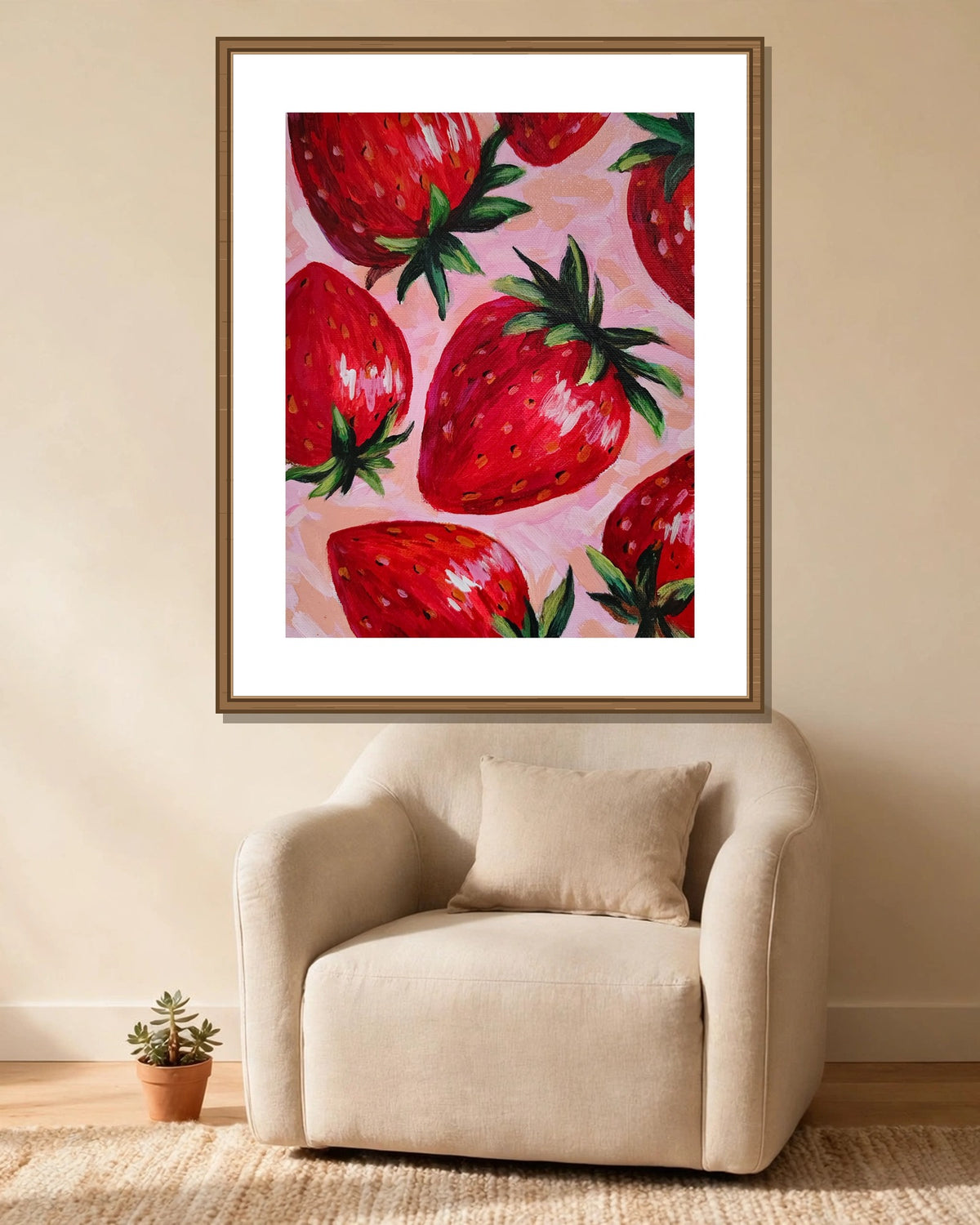 Strawberries on Pink framed print styled in a cozy reading corner — frame not included